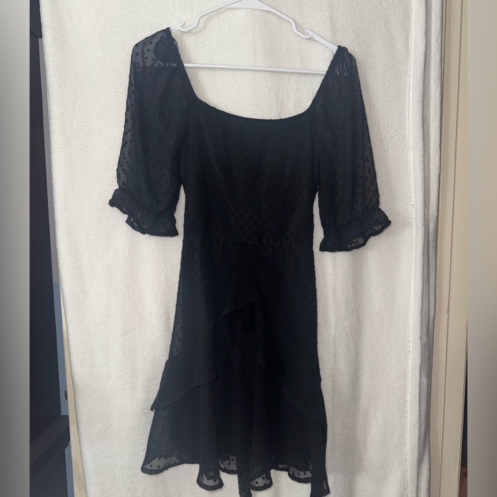 Small, Francesca‘s black polkadot dress.